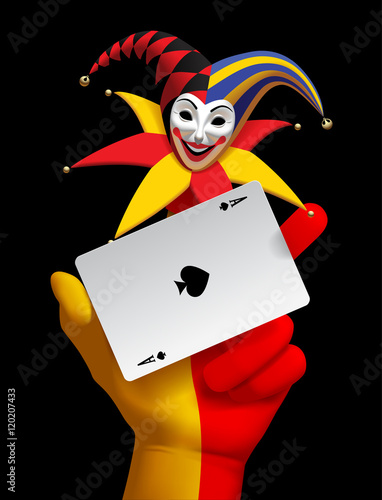 Human hand with a smiled Joker head and ace playing card