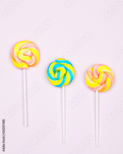 Flat lay. Three colorful lollipops