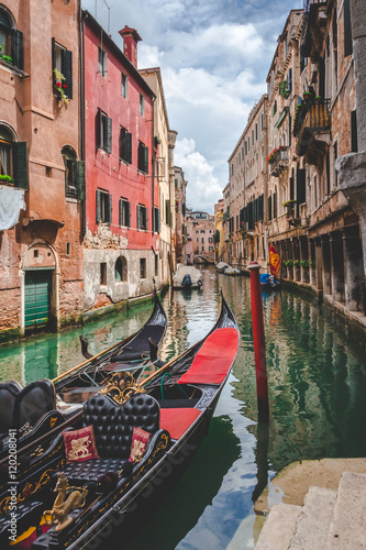 Canal, gondolas and houses in Venice