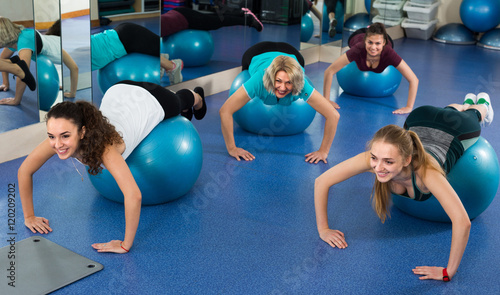 women jumping on exercise ball