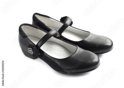 Pair of black shoes for girl on white background