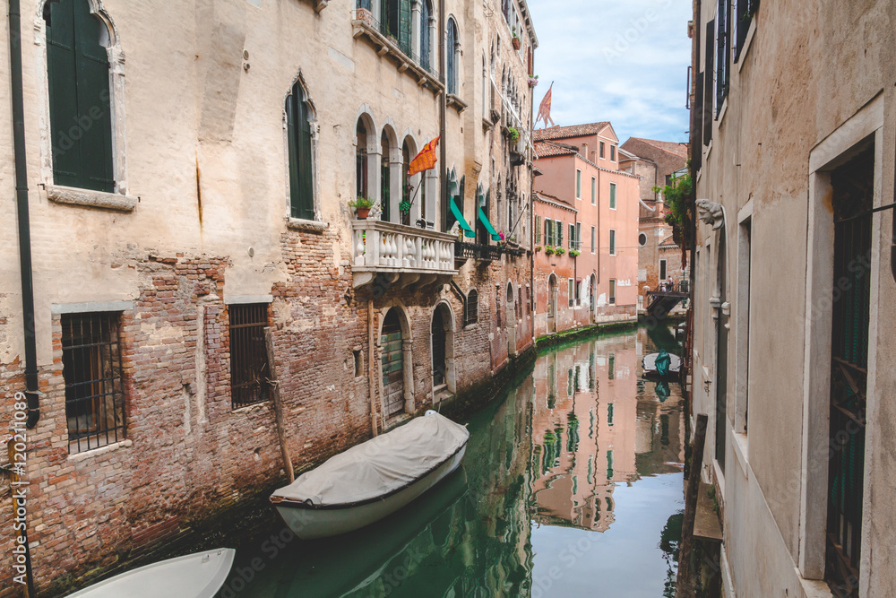 Fototapeta Canal, boat and houses in Venice