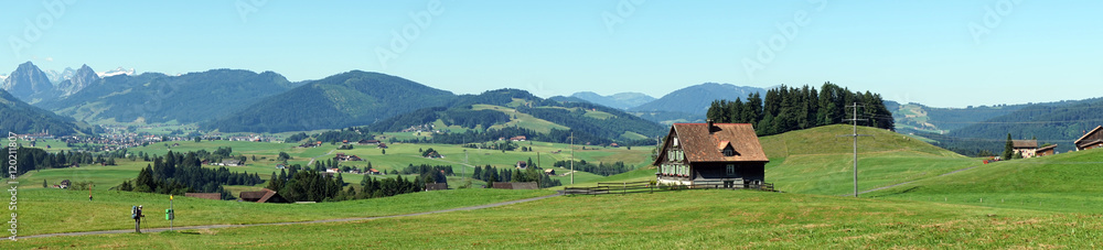 Panorama of farm house and green pasture