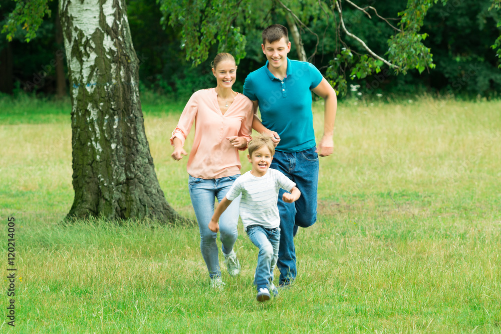 Fototapeta premium Boy Running Ahead Of His Parent