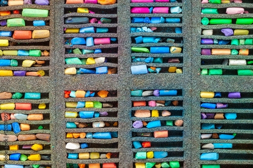 Set of multicolored pastel crayons, top view.