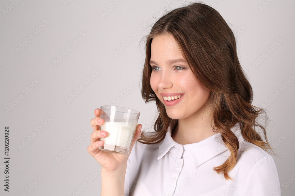 Lady with glass of milk. Close up. White background Lady with glass of milk. Close up. White background