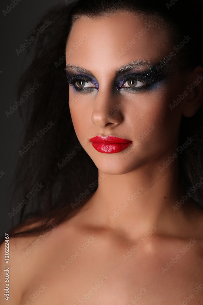 Naked girl with makeup. Close up. Black background Naked girl with makeup. Close up. Black background