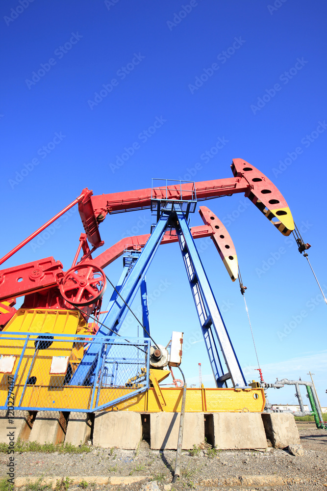 Oil field, oil pump in the work Oil field, oil pump in the work