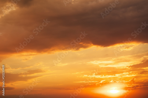 Fototapeta Naklejka Na Ścianę i Meble -  Beautiful fiery sunset sky. The clouds lit with the sun at sunse