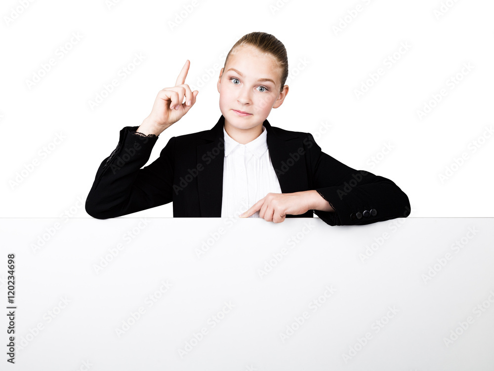 Little business woman standing behind and leaning on a white blank billboard or placard, expresses different. forefinger up Little business woman standing behind and leaning on a white blank billboard or placard, expresses different. forefinger up