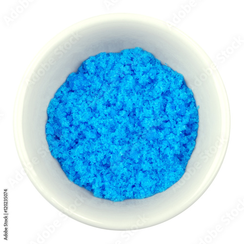 Fotografie Cupric sulfate in porcelain bowl over white