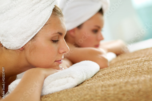 Two young girls relaxing at spa salon