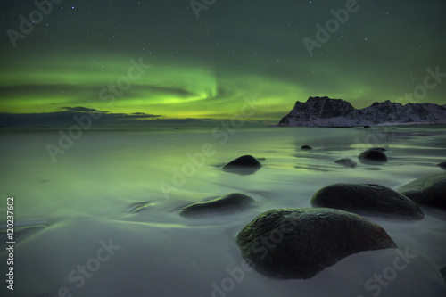 Aurora borealis over a beach on the Lofoten in Norway © sara_winter
