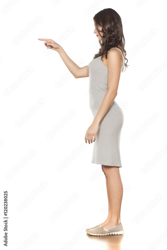 young beautiful woman posing in a short dress and espadrille young beautiful woman posing in a short dress and espadrille