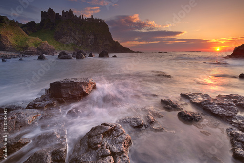 The Dunluce Castle in Northern Ireland at sunset