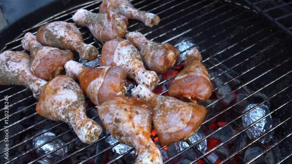 Pouring sauce on chicken legs at round barbeque. Grilling process. Slow Motion
Pouring sauce on chicken legs at round barbeque. Grilling process. Slow Motion