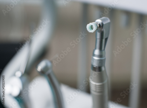 Close-up of dental drill bit with head for polishing and brushing teeth. Stomatological equipment