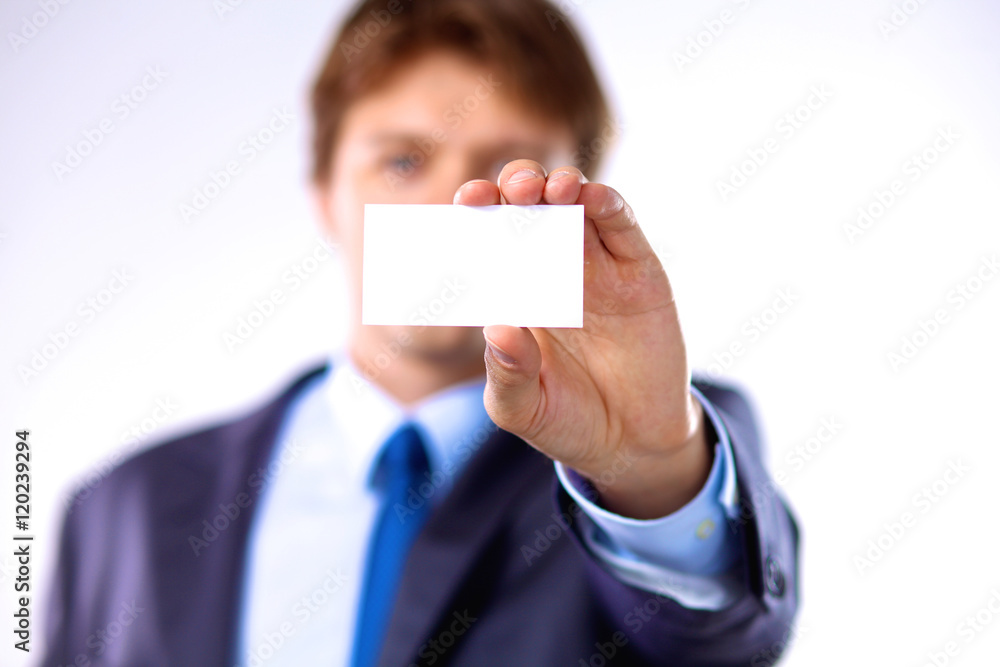 young businessman holds out his hand with a business card for love young businessman holds out his hand with a business card for love