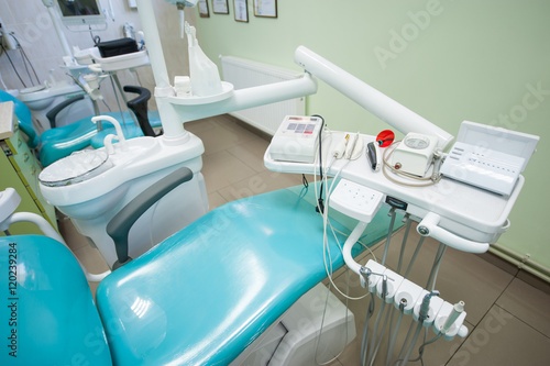 Tools for dental treatment in dentist s clinic. Dental unit and accessories to it  drills  photopolymer lamp  equipment for restorative dentistry