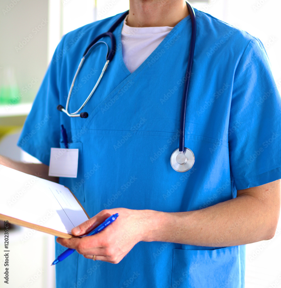 Closeup portrait of a doctor with stethoscope holding folder Closeup portrait of a doctor with stethoscope holding folder