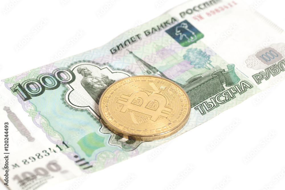 Golden bitcoin coin (digital virtual money) on Russian one thous Golden bitcoin coin (digital virtual money) on Russian one thous