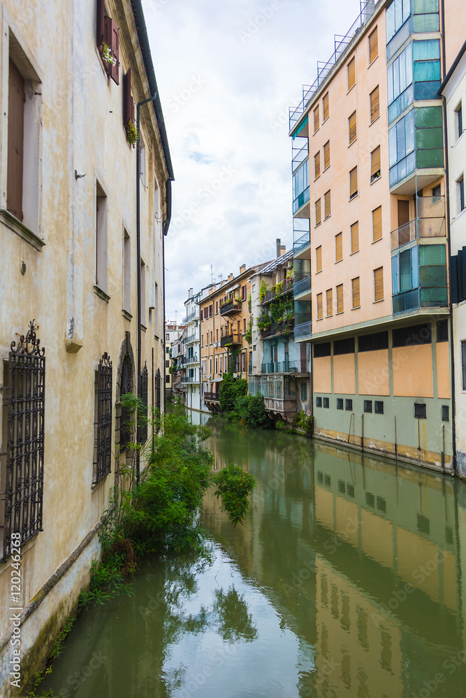 canal San Massimo runs among residential houses