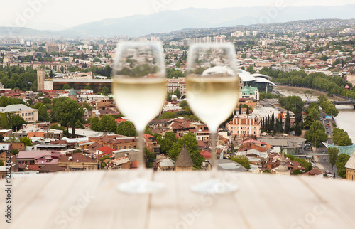 Two glasses on white wine on the table in Tbilisi, Georgia.