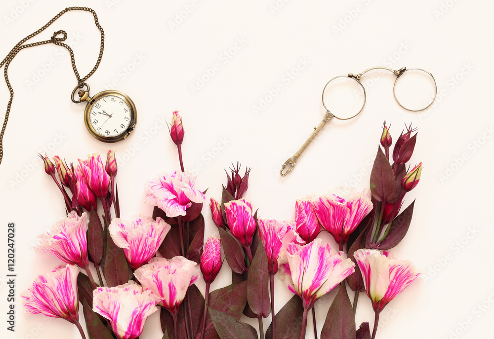 Fototapeta premium beautiful flowers and vintage glasses and pocket watch