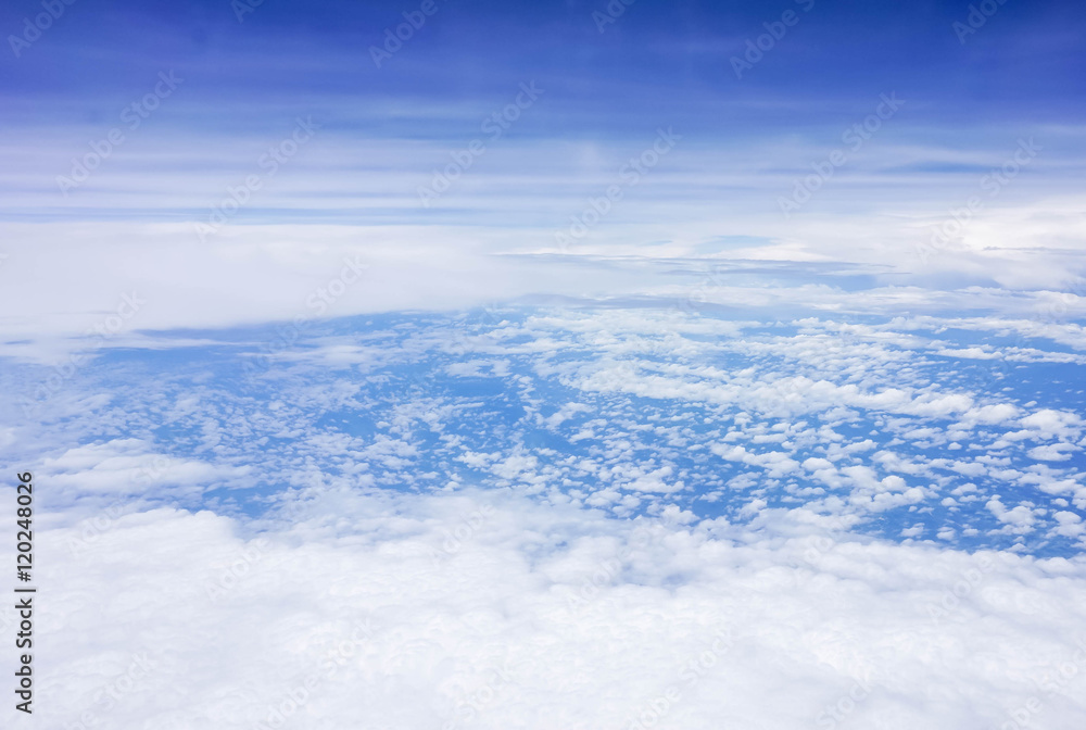 Naklejka premium blue sky high view from airplane window clouds shapes