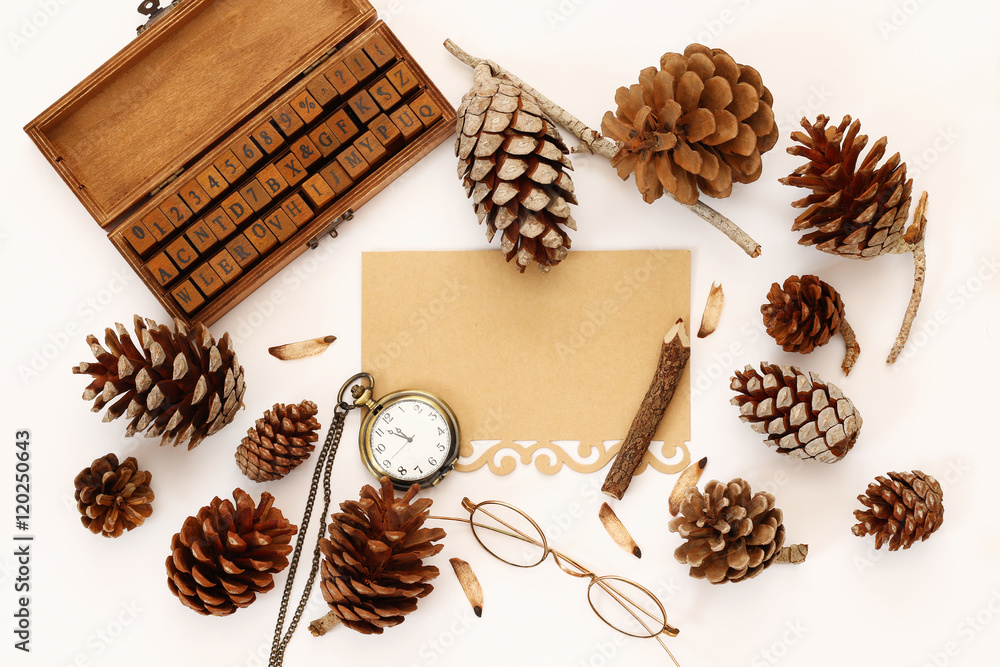 Top view of pine cones, gift box and blank card Top view of pine cones, gift box and blank card