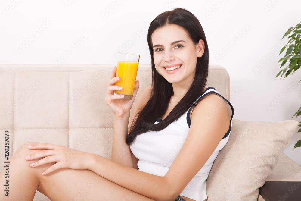 Woman drinking orange juice Beautiful mixed-race Asian, Caucasian model.