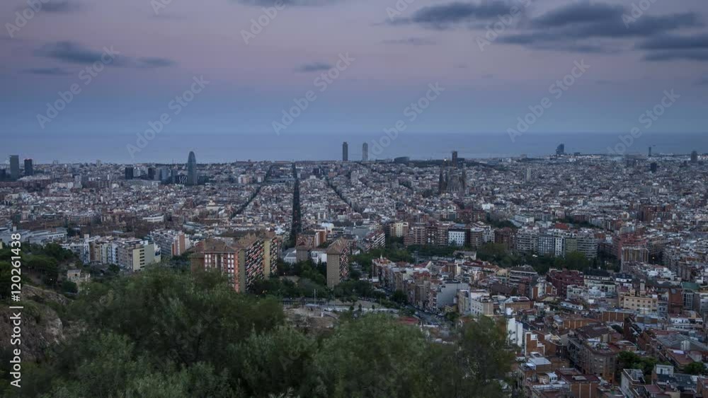 Time lapse video of the city of Barcelona, Spain during late evening featuring the illuminated city lights and the landmark buildings of La Sagrada de la Familia and Torre Agbar Time lapse video of the city of Barcelona, Spain during late evening featuring the illuminated city lights and the landmark buildings of La Sagrada de la Familia and Torre Agbar