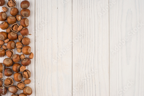 Hazelnuts on a old wooden table.