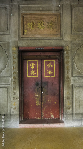 The classic door chinese style(Lucky door) and chinese art architecture in Wat Leng Nei Yee Chinese temple in Yaowarat road,Bangkok capital city,Thailand.