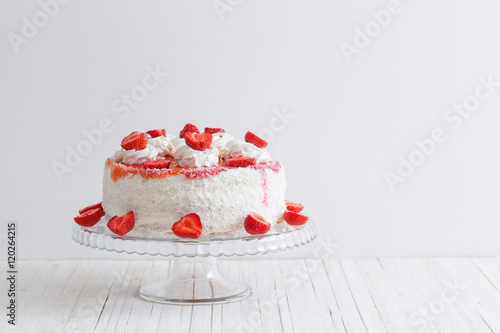 cake with strawberries on white background