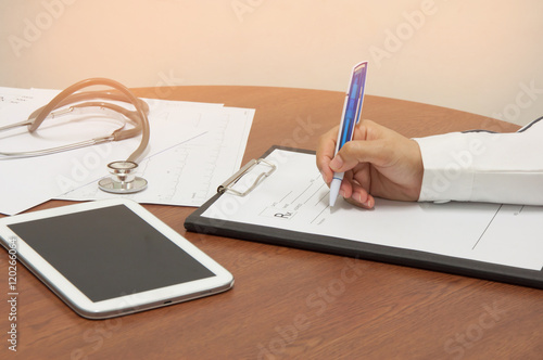 Doctor writing a medical prescription.