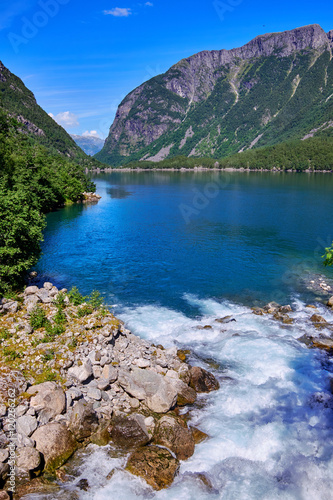 The mouth of a runoff with water from Folgefonna glacier running out in Bondhussoeen in Hardanger, Norway