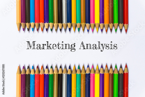 Text Marketing analysis on color pencil background / business concept