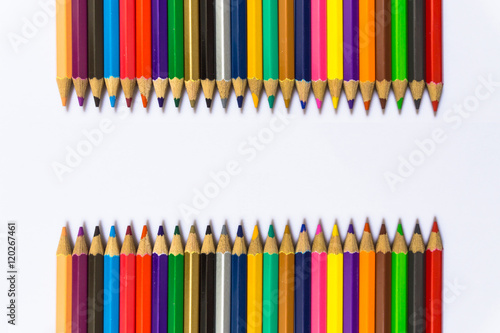 Colour pencils isolated on white background close up.