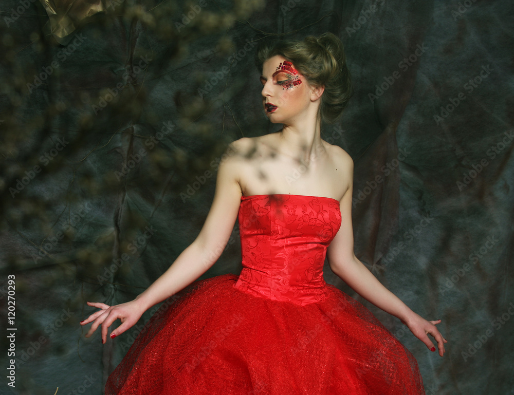 Fototapeta premium Portrait of a beautiful woman in medieval era dress. Shot in a s