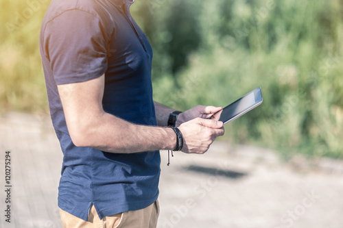Man using digital Tablet outdoor