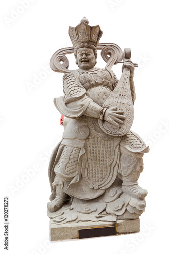 A stone carving of Chinese god playing a musical instrument isol