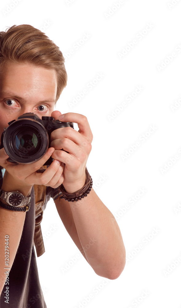 Closeup portrait of a young man taking a picture from corner Closeup portrait of a young man taking a picture from corner