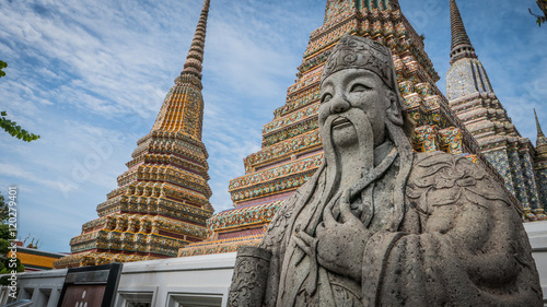 The beautiful of  stone Thai - Chinese style sculpture and thai art architecture  in Wat Phra Chetupon Vimolmangklararm (Wat Pho) temple in Thailand. photo