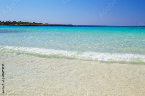 Clear water and white sand at Cala Son Saura beach, Menorca. © tuulijumala