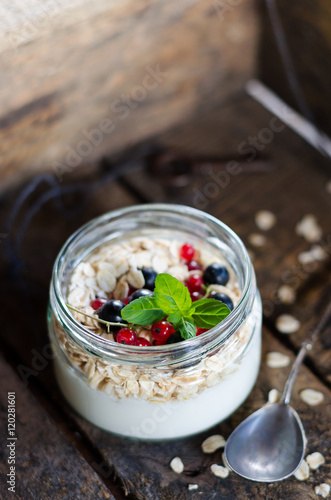 yogurt with berries and products for healthy breakfast, close-up
