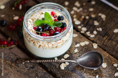 yogurt with berries and products for healthy breakfast, close-up
