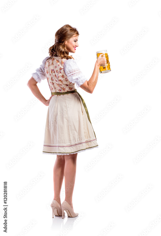 Woman in traditional bavarian dress holding beer