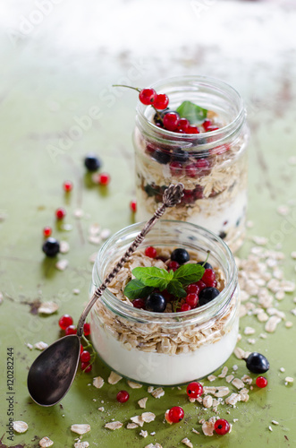 yogurt with berries and products for healthy breakfast, close-up
