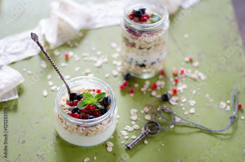 yogurt with berries and products for healthy breakfast, close-up
